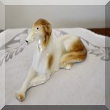 P28. Porcelain dog figurine. Made in Germany. 3”h x 6”w - $10 